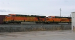BNSF 5735 and 5771 leading train of MBKX hoppers waiting for clearance in the rain